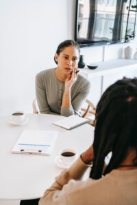 two women engage in a conversation