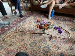 a carpet surrounded by people's feet