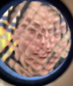 a distorted prismatic image of a face