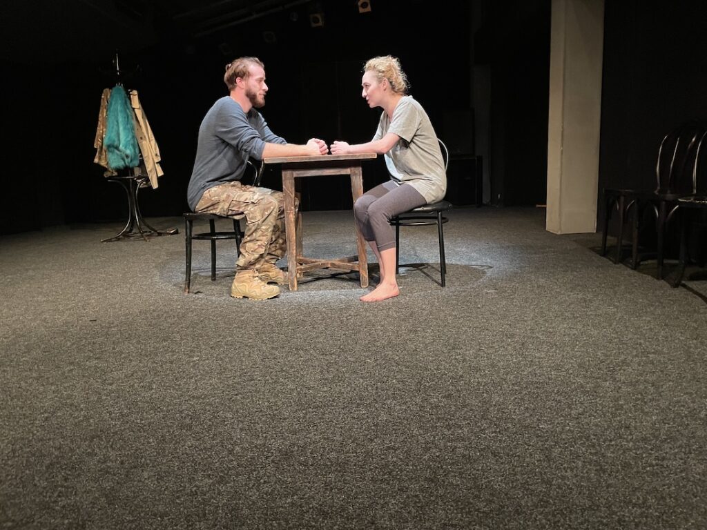 Actors in confrontation on a stage