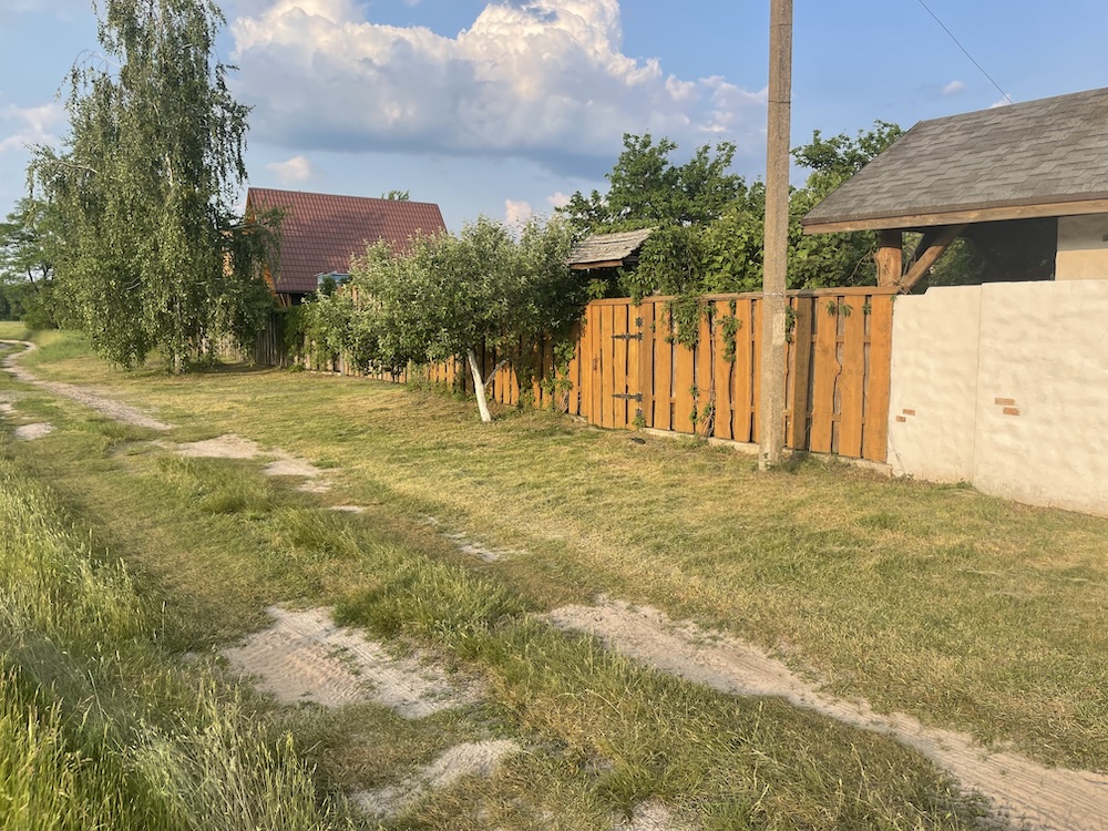 A humble home with a fence.